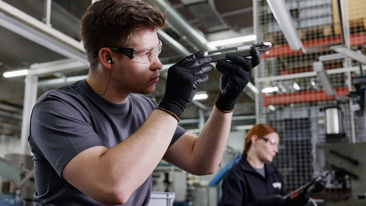 A Sako professional inspecting product quality